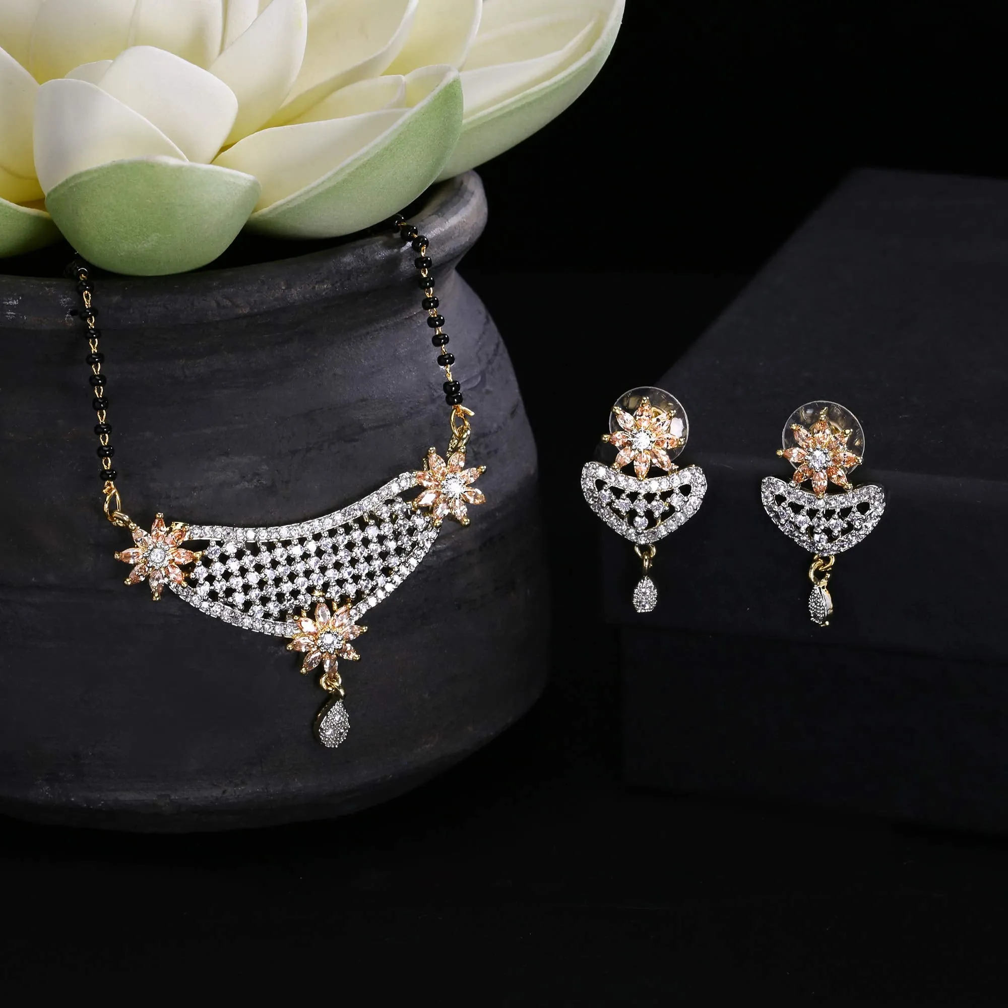 Yellow Chimes Classic Gold AD/American Diamond Studded Black Beads Designer Floral Mangalsutra Set with Earrings for Women